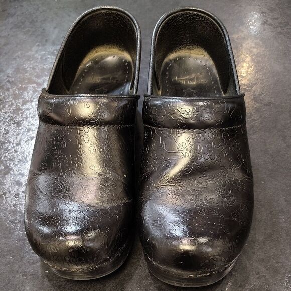 Dansko Black Floral Embossed Clogs - Picture 2 of 6